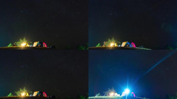 星星在夜空和野营帐篷前景上移动，延时视频