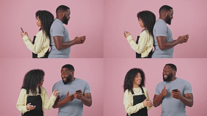 在线约会应用程序。年轻的非洲裔美国男女在智能手机上发短信，背靠背站着，