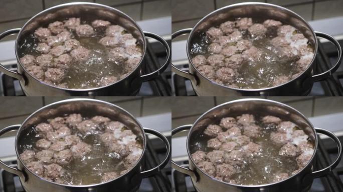 在沸水中自制肉丸。汤的制备过程。特写。选择性聚焦