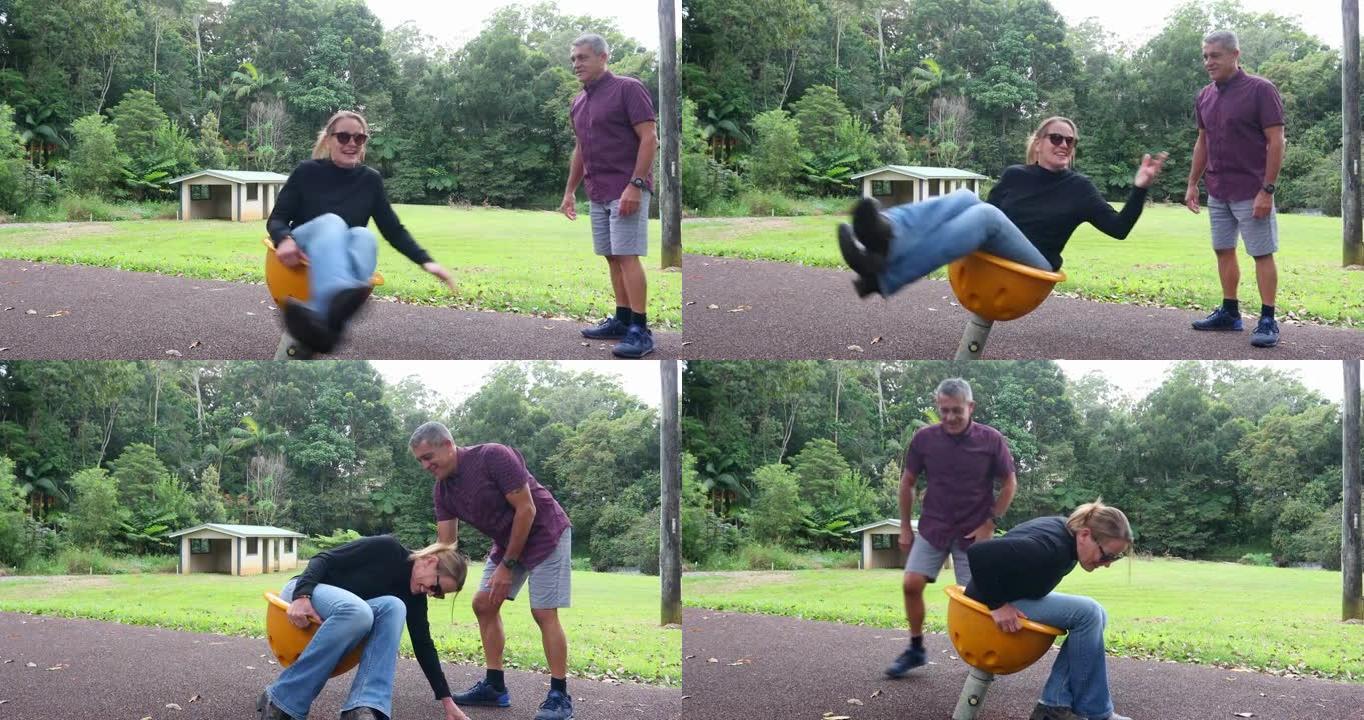 成熟的毛利人和他的妻子在公园玩耍