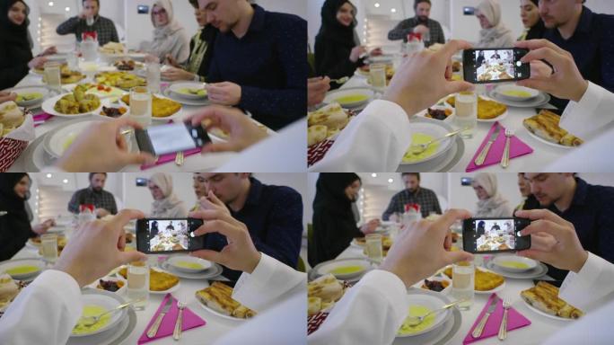 伊斯兰清真饮食伊斯兰家庭成员用电话拍照