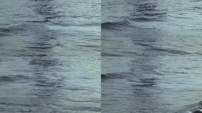 水的底面。黎明时的波浪，前景。