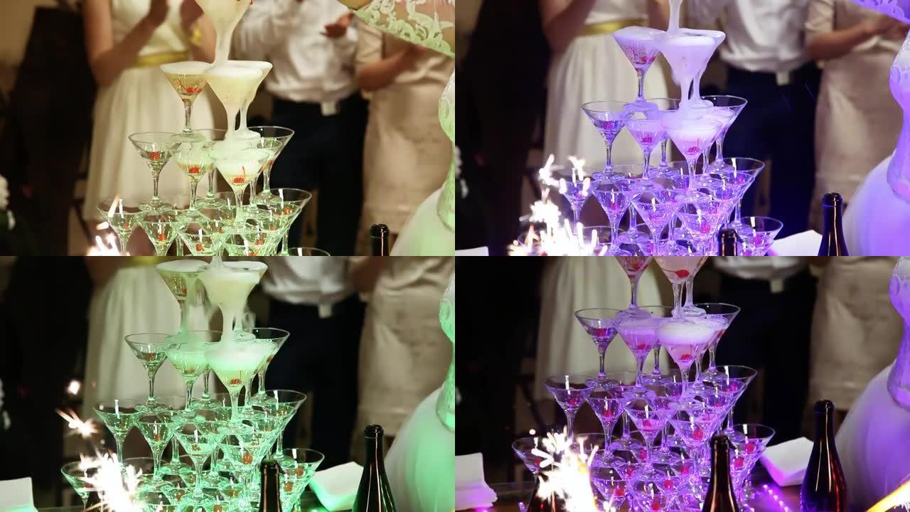 用香槟装满玻璃杯。香槟杯金字塔。酒保肖