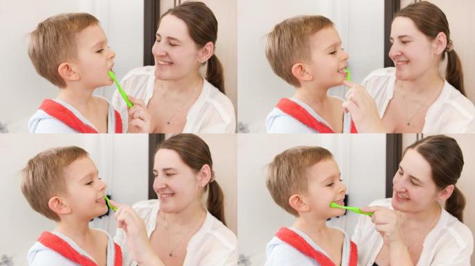 微笑的小男孩在浴室里和微笑的母亲刷牙和清洁牙齿的肖像。家庭儿童卫生和保健概念。在家关心父母和孩子。