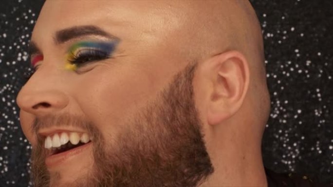 一名男化妆师的4k视频片段愉快地展示了他完整的眼睛外观