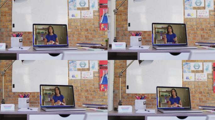 非裔美国女老师在学校桌子上的笔记本电脑上进行视频通话的网络摄像头视图