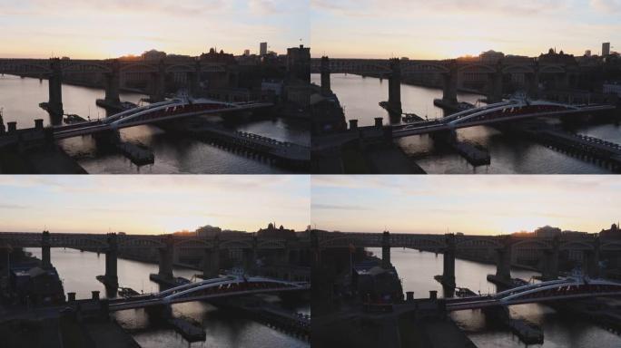 泰恩河和纽卡斯尔天际线的平移镜头，在黄金时段有秋千桥和高架桥