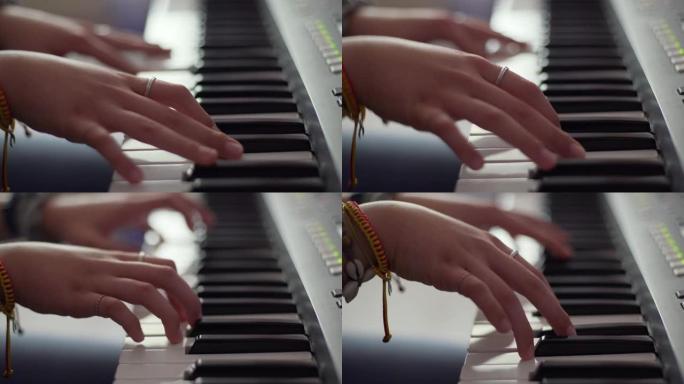 背景模糊的女人手弹钢琴