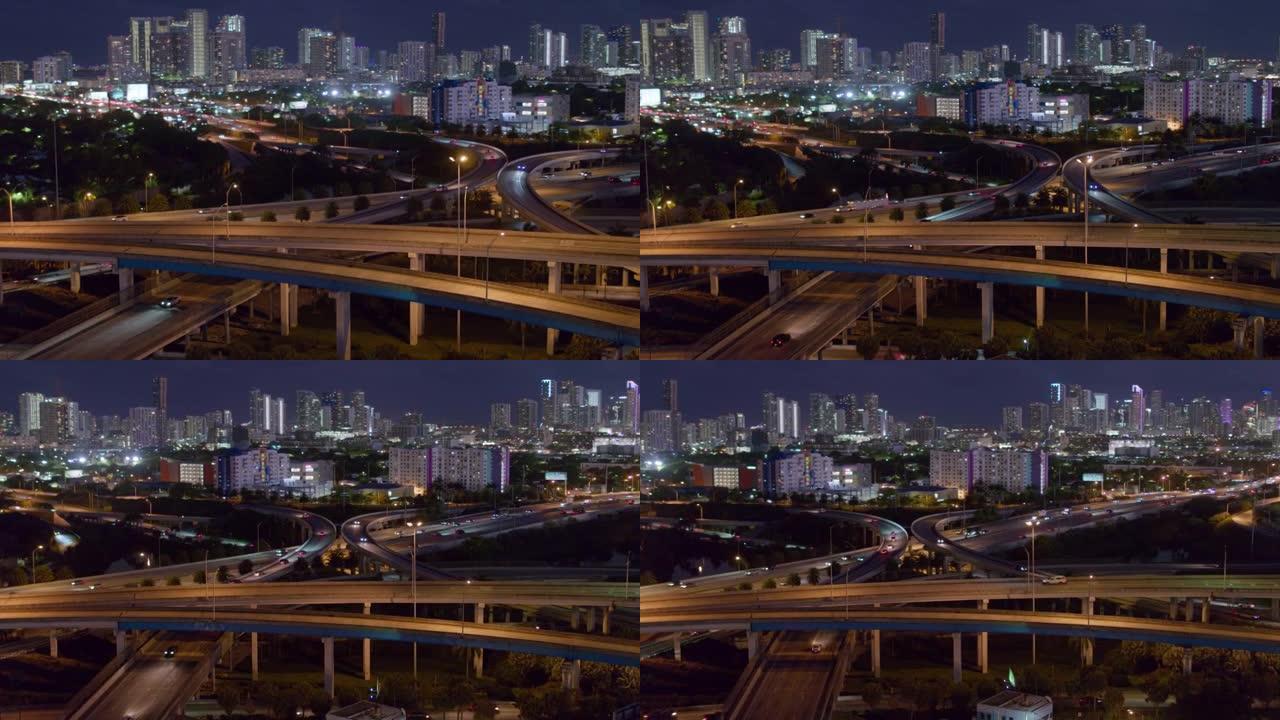 佛罗里达州北迈阿密高架交界处迈阿密设计区的夜间鸟瞰图。无人机制作的b-roll镜头带有平移轨道的电影