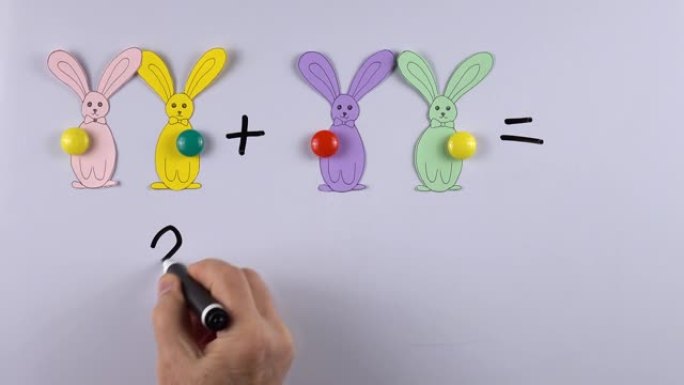 老师借助磁铁和兔子的数字教孩子们数学加法的基础