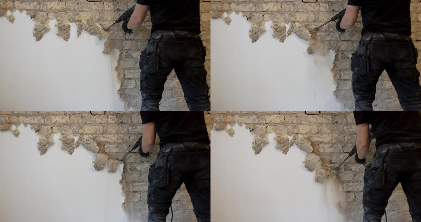 工人用sds钻头从室内砖墙上清除灰泥