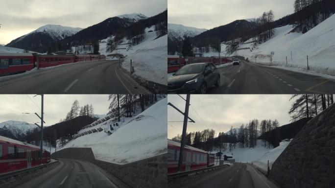 贝尔尼纳快速铁路红色列车冬季雪格里森附近的道路