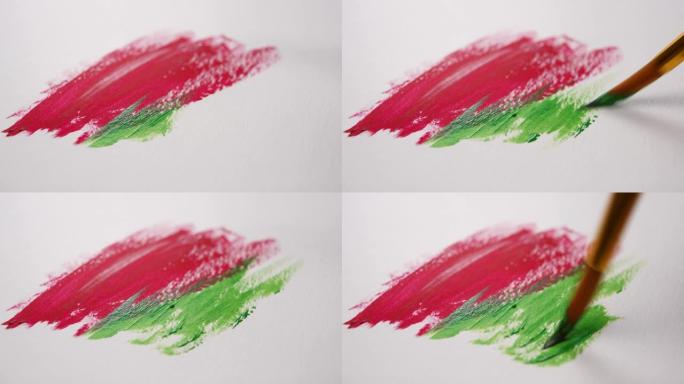 画笔绘制红色和绿色丙烯酸涂料