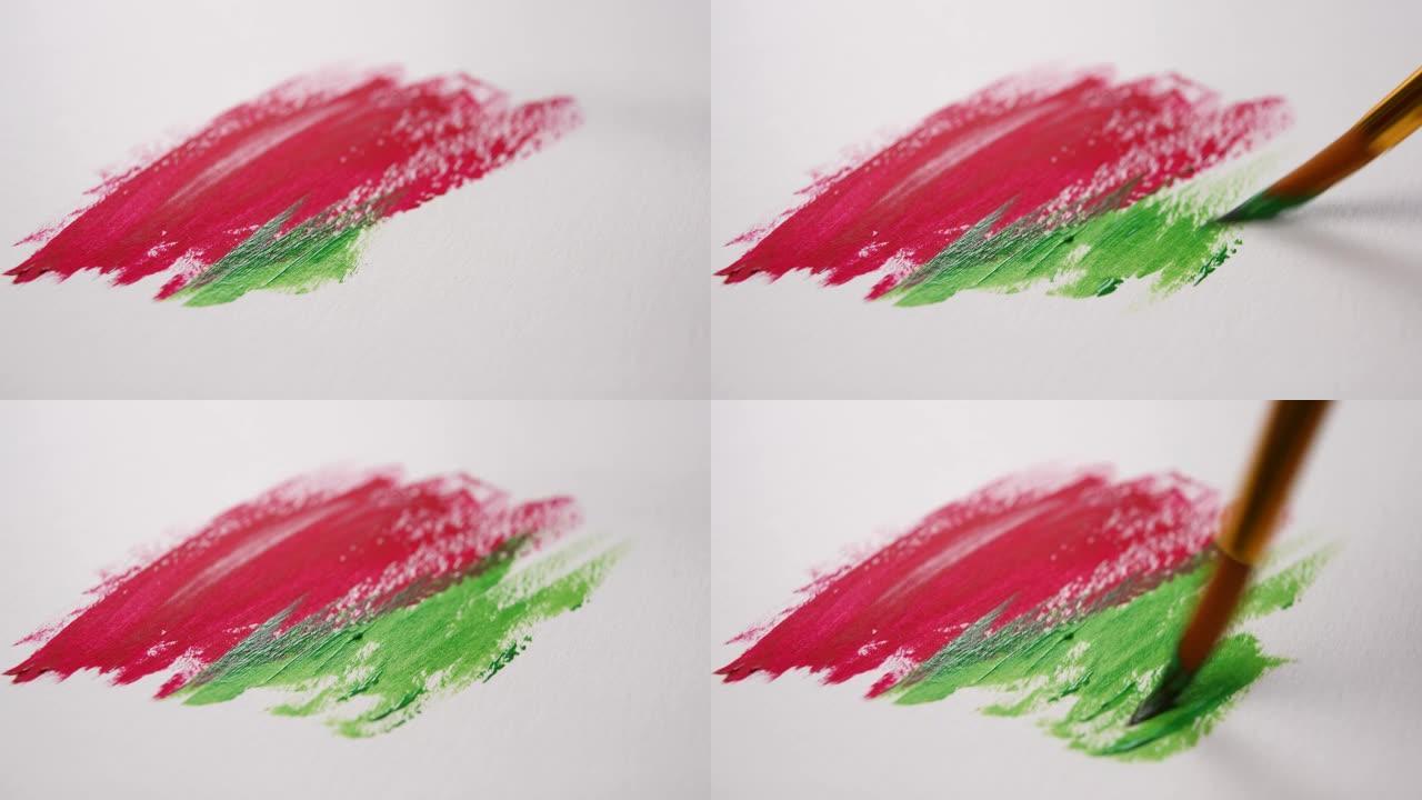 画笔绘制红色和绿色丙烯酸涂料