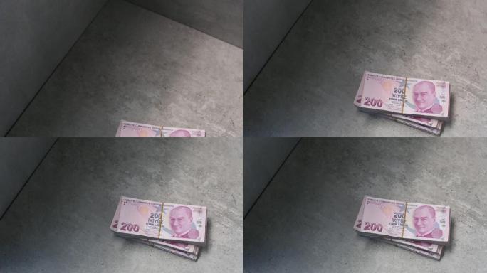 混凝土地板上的一堆土耳其货币200土耳其里拉