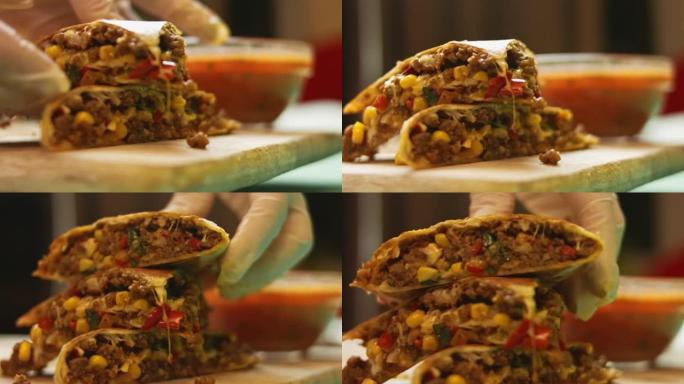 在木制切菜板上新鲜油炸的热牛肉饼和莎莎酱。制作墨西哥玉米饼的过程。侧视图