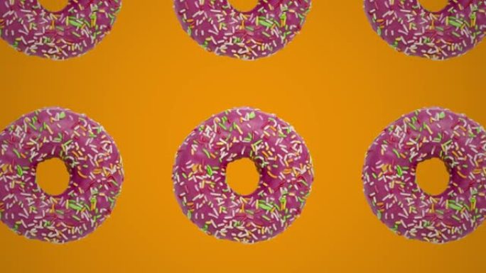 橙色背景上的粉色甜甜圈几何图案。简单的运动图形食物概念无缝循环动画