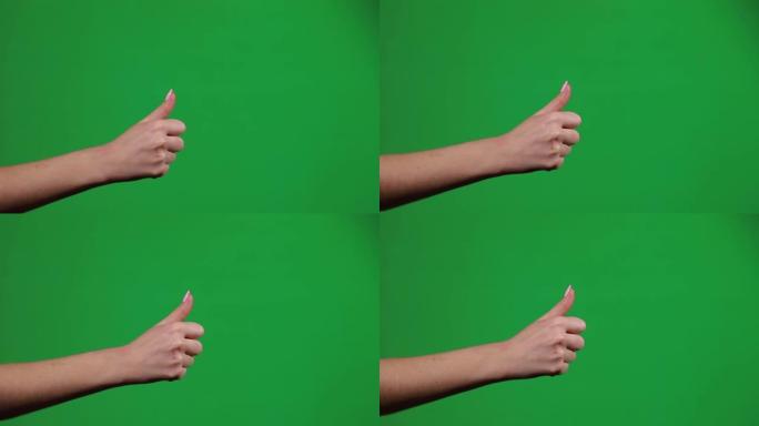 在色度凯背景上竖起大拇指，竖起大拇指手势。男性手