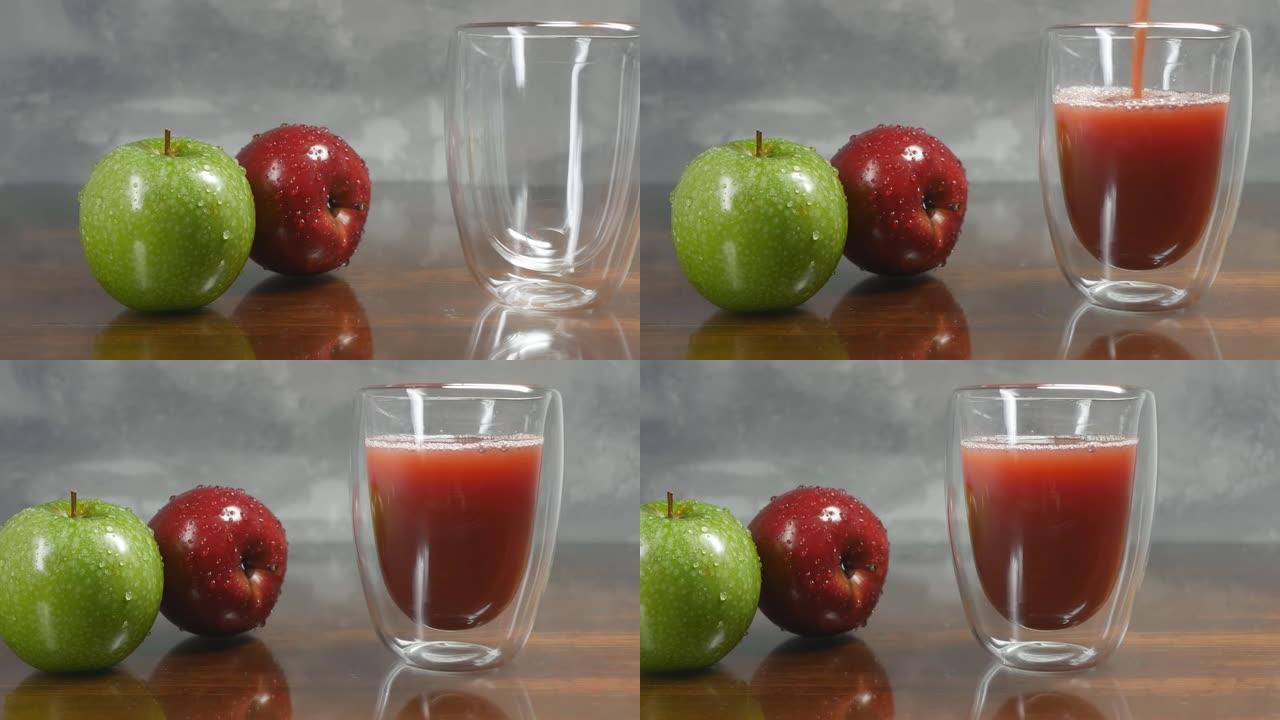 将鲜榨的苹果汁倒入双层玻璃烧杯中。桌子上有两个苹果，绿色和红色。苹果被雨滴覆盖着。多莉