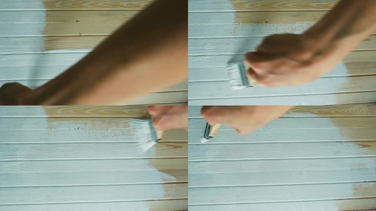 女孩用白色油漆画木板，顶视图
