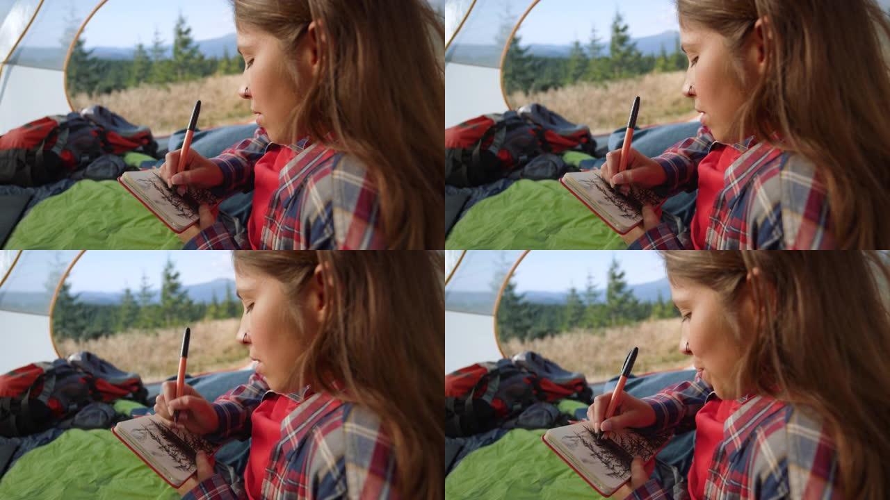 女人在记事本上画树木的草图。轻松的女孩用钢笔画画