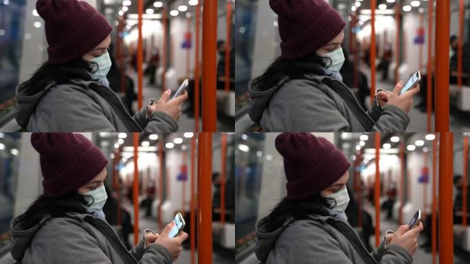 在火车内使用智能手机戴口罩的女人