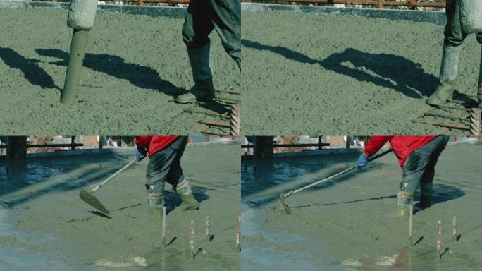 工程师将混凝土钢筋浇注到地板金属结构底座低角度中。用湿水泥浇筑地板的工人。穿着胶靴的建筑商与固井机一