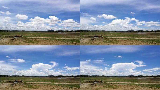 在马拉维的一个水坑上眺望，清脆的蓝天白云的延时