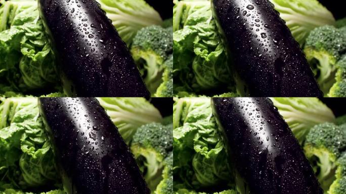 特写慢动作视频，水滴从茄子皮肤上落下并流下。健康营养和有机食品的概念。素食主义者或素食主义者的完美背