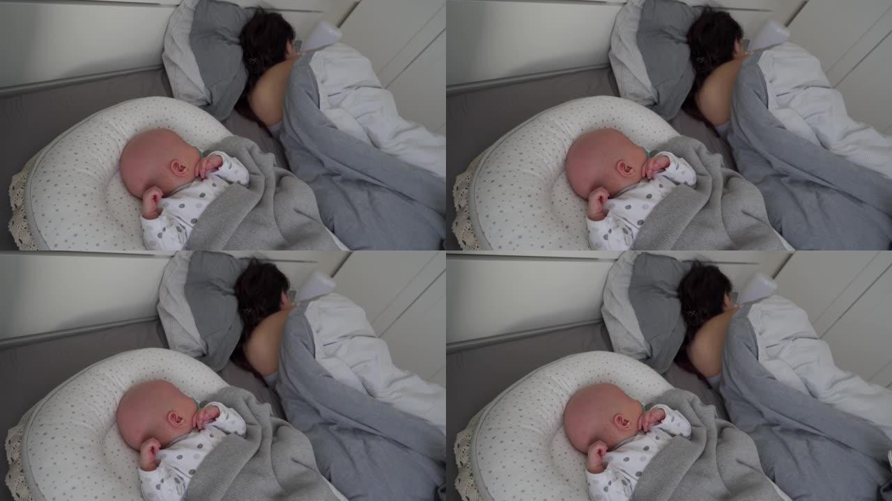可爱的男婴躺在婴儿荚巢新生儿茧，婴儿睡眠安全，与婴儿共睡床。