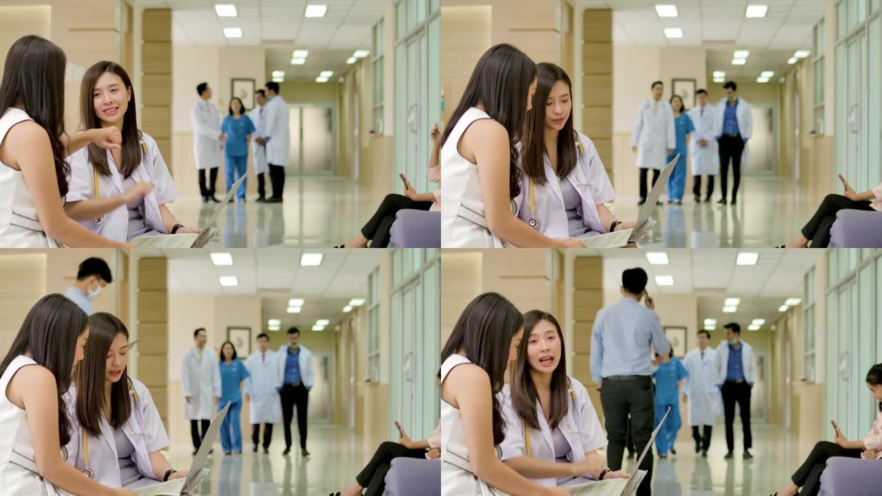 医生和病人在医院大厅一起讨论和交谈。