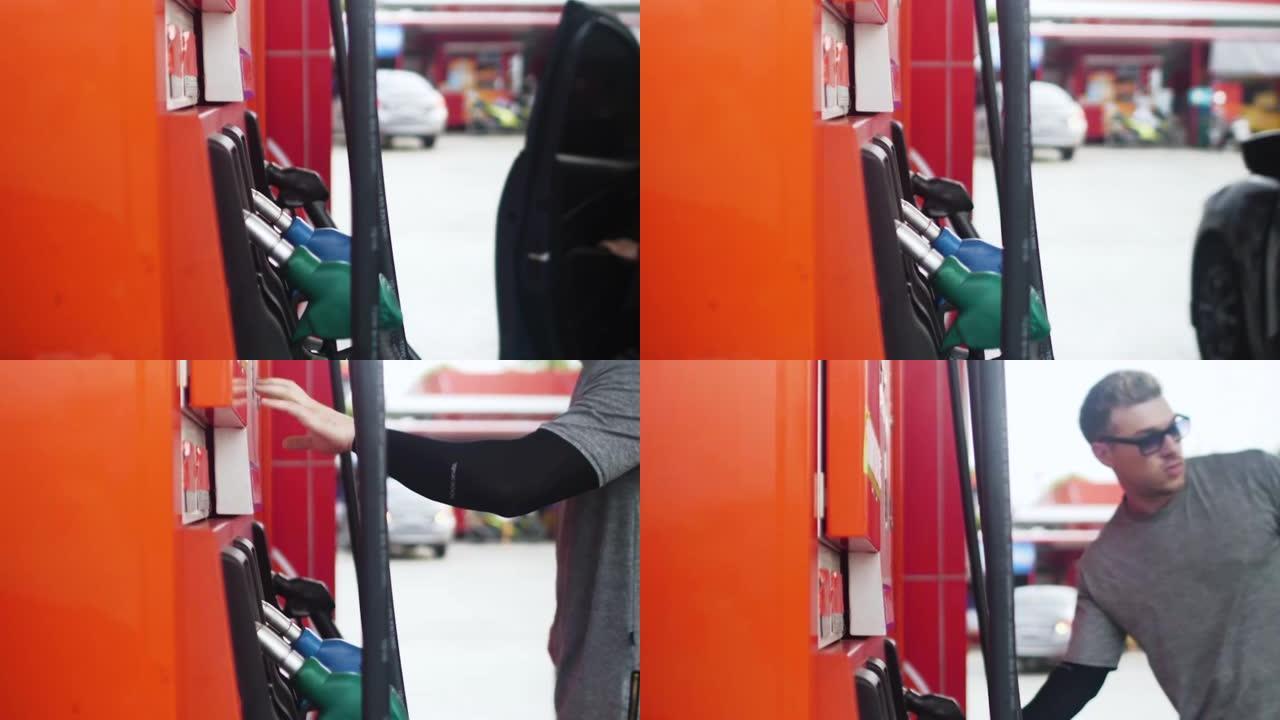 男子在加油站加油汽油车
