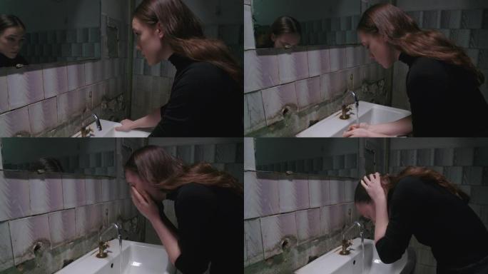 年轻女子洗脸的慢动作视频