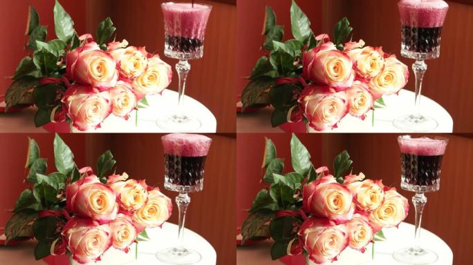 水晶酒杯和一束玫瑰中的起泡酒