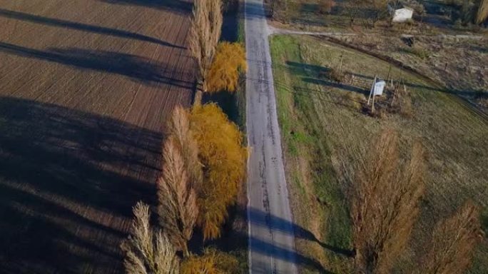 空中无人机视图: 空旷的乡村阳光路。春天