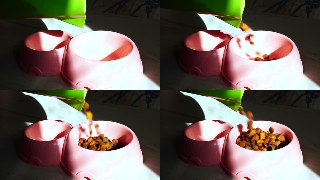 脆皮垫以慢动作落在kitty粉红色碗中