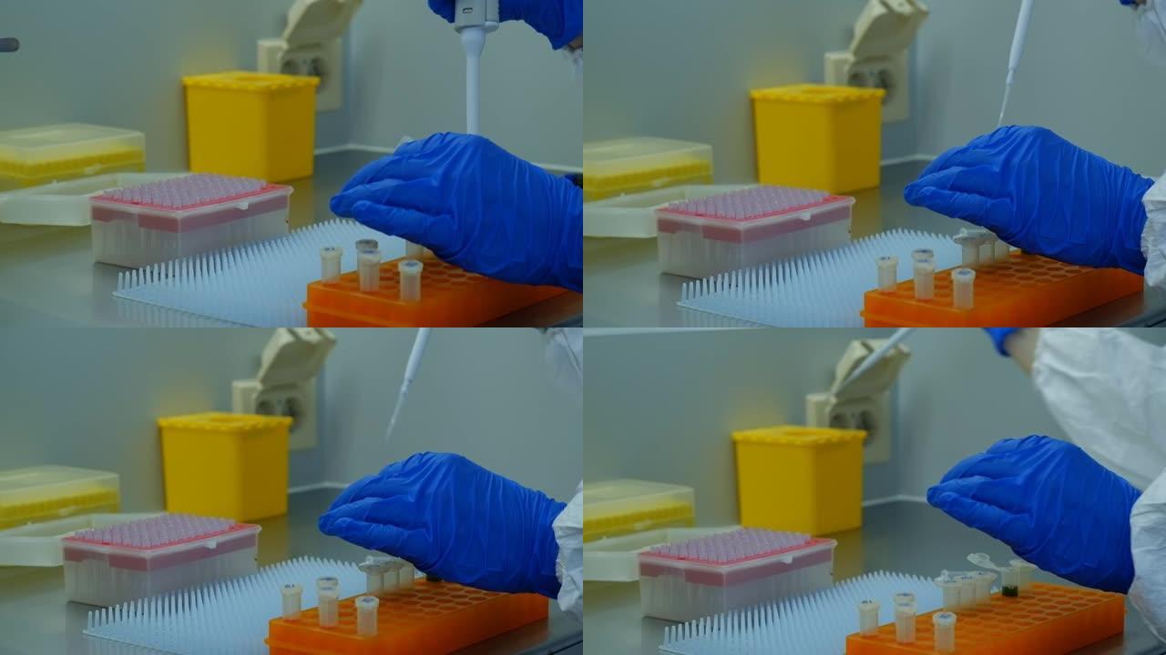病毒学家在实验室里用病毒疫苗工作。他用疫苗填充实验室移液器