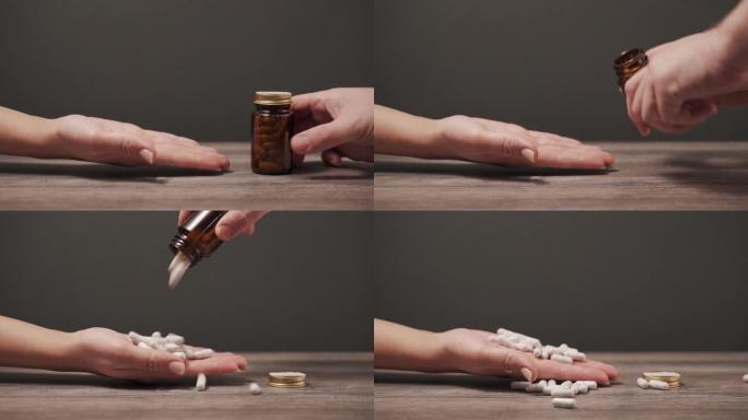 男性的手将少量药丸从罐子里倒入女性的手掌中