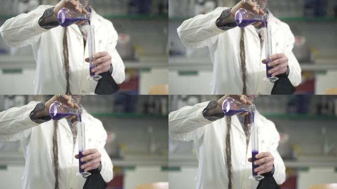 用手将烟熏液体倒入化学物质中。科学家在实验室里做实验