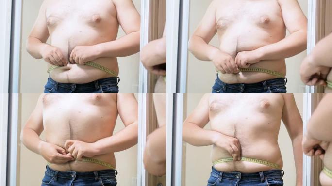 4k视频超重男子试图用镜子上的黄色卷尺测量他的大肚子