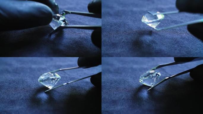 珠宝商使用银镊子和黑色乳胶手套检查大半透明钻石，以验证它是真品还是假的