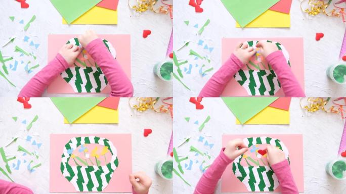 制作自制贺卡的孩子。小女孩用纸和粘土制成的鲜花篮子，橡皮泥作为母亲节或情人节的礼物。传统游戏概念。工