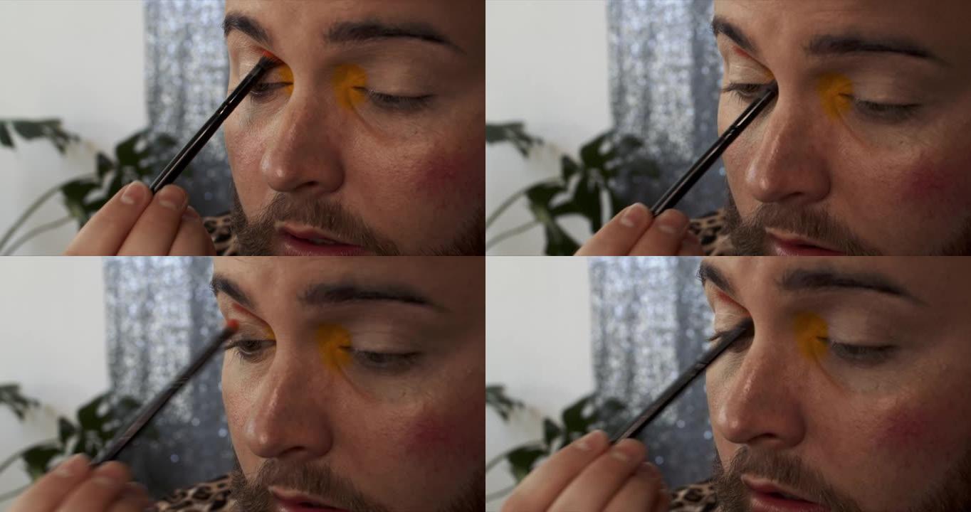 一名男性化妆师在眼睑上涂上亮粉色眼影的4k视频片段