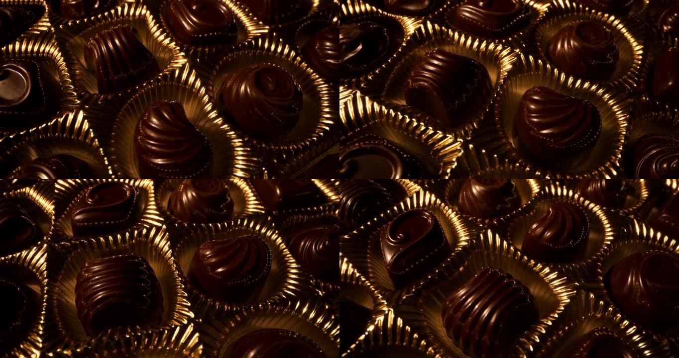 旋转巧克力糖果盒。金色包装