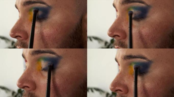 一名男性化妆师混合他的眼影的4k视频片段