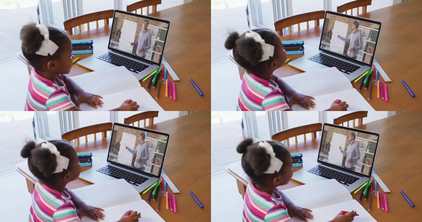 非裔美国女孩坐在桌子上使用笔记本电脑上在线学校课程