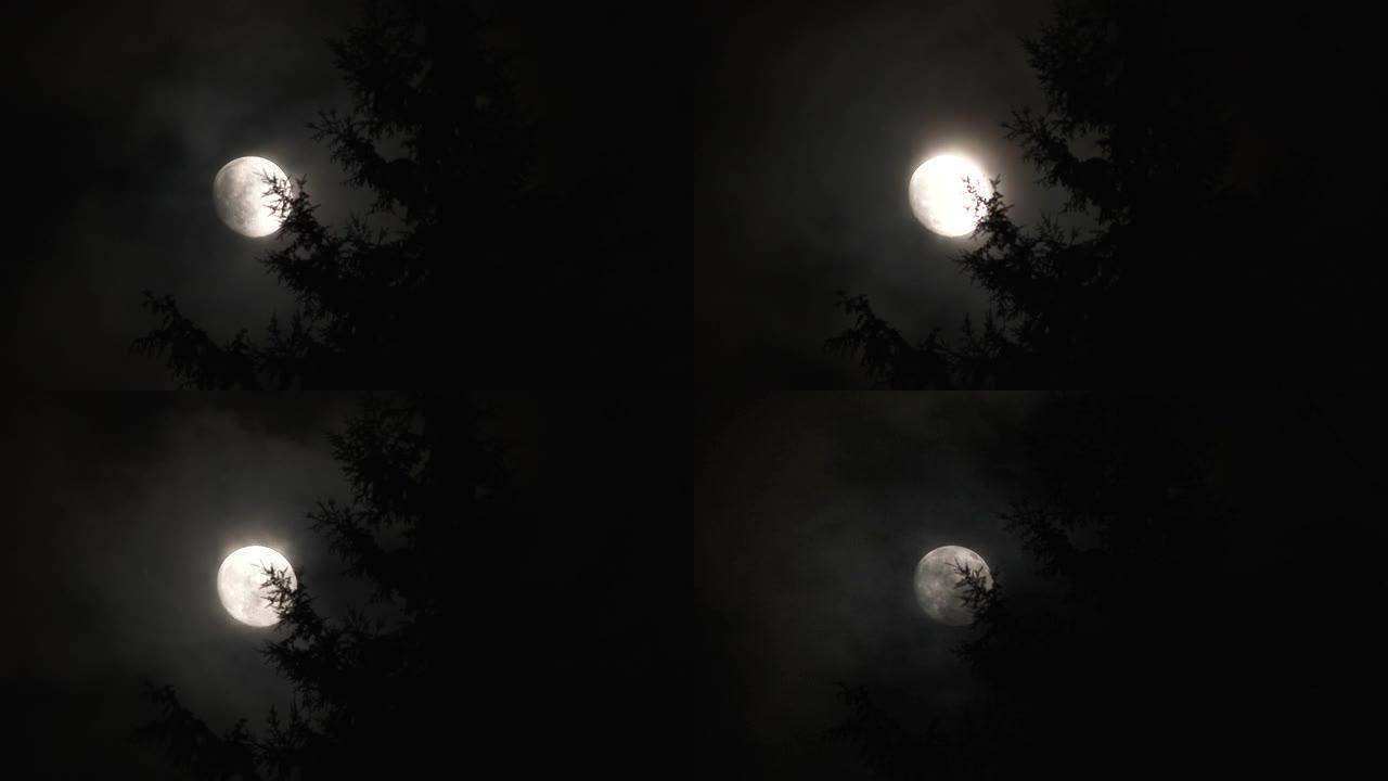 晚上满月消失在暴风云中