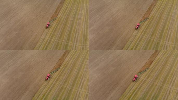 空中: 拖拉机犁草皮土壤
