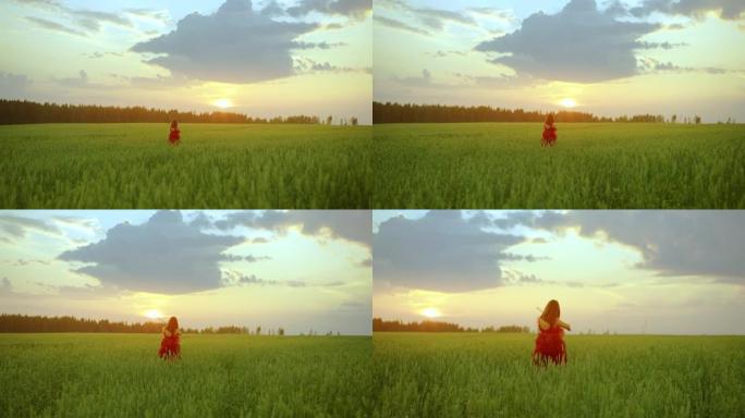 一个穿着红色连衣裙的女孩在田野中央拉小提琴