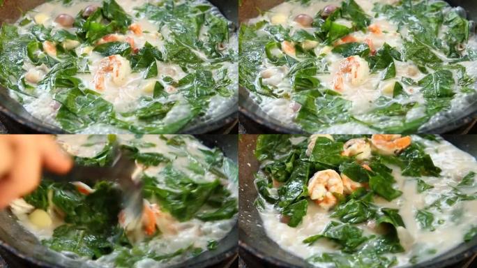 用虾煮椰奶汤中的Melindjo叶子